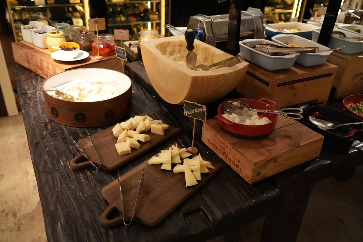 Cheese dishes laid out on a buffet table