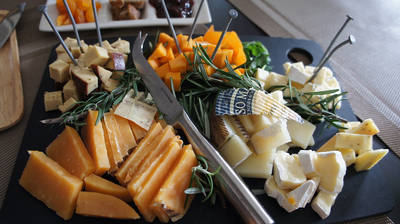 Cheese and crackers laid out on a serving platter